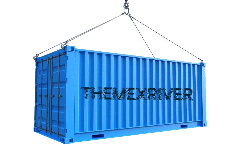 A shipping container being lifted by crane cables