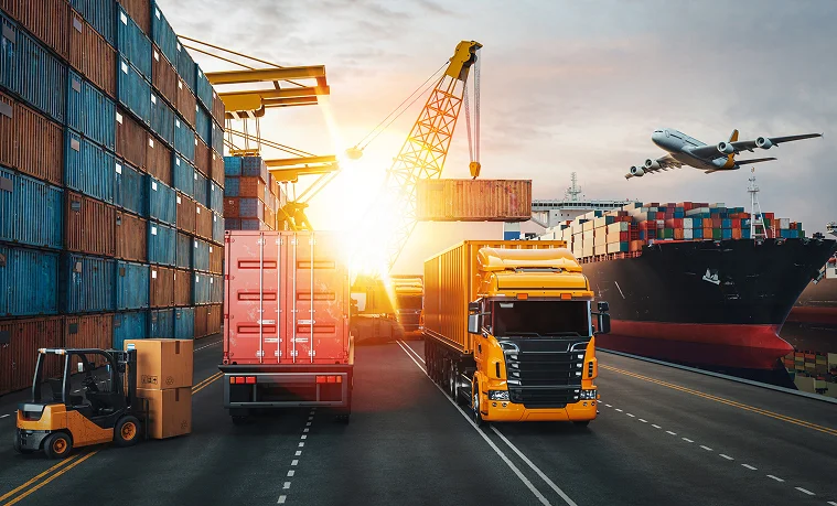 Trucks moving containers at a busy port terminal